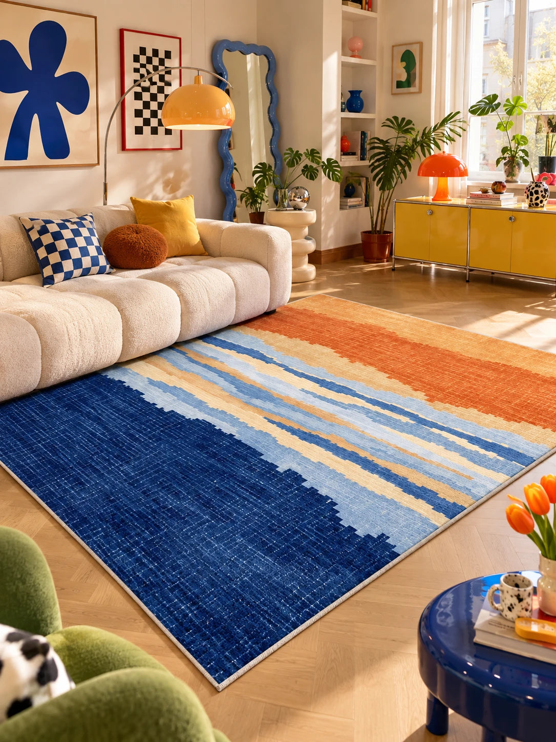 Blue and orange gradient rug in a living room with orange arc lamp and wavy blue mirror