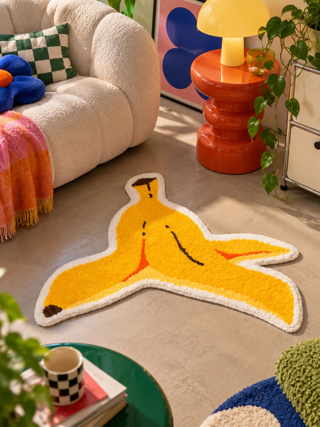 Banana peel floor mat beside a cream boucle sofa and orange gourd side table