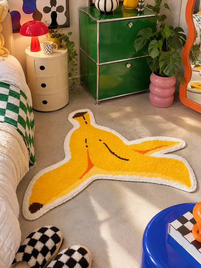 Banana peel floor mat in a bedroom between a bed and a green metal cabinet