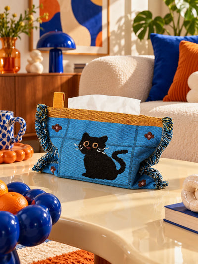 blue cat knitted tissue pouch on a coffee table