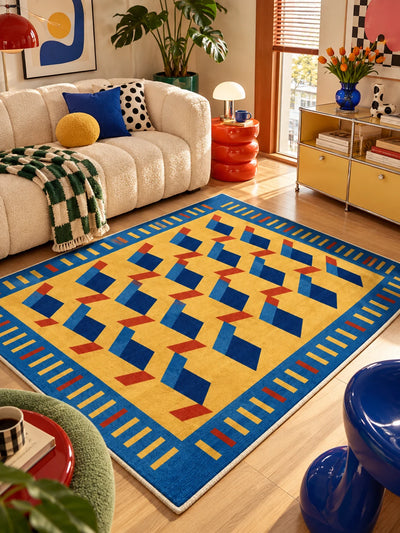 Yellow and blue ribbon geometric rug in front of a cream boucle sofa and red gourd side table