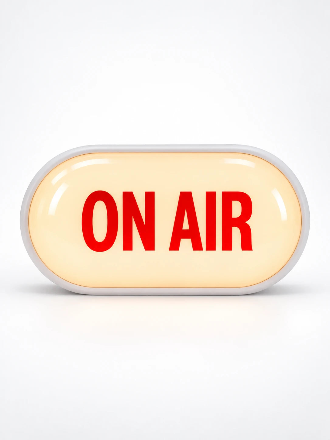 
Glowing capsule ON AIR light box sign with white frame and warm lit face