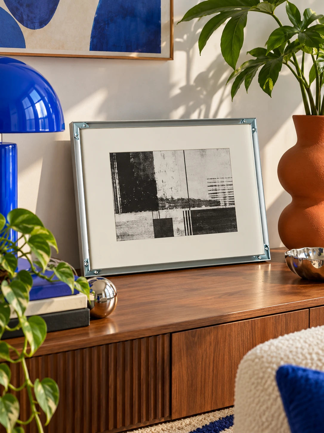 silver aluminum poster frame displayed in a bright interior