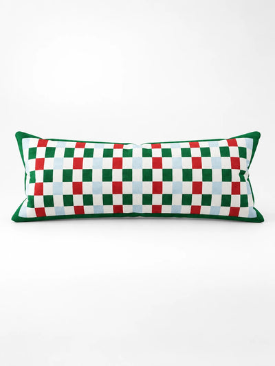 Long lumbar pillow with a red, green and pale blue checkerboard grid and a green border, studio shot
