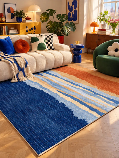 Sunset stripe rug with a green swivel chair, wood credenza and yellow bookshelf behind