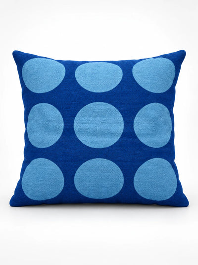 royal blue throw pillow with a grid of large light blue dots, studio view