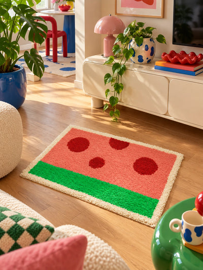 watermelon flocked mat in front of a cream media console with a pink lamp
