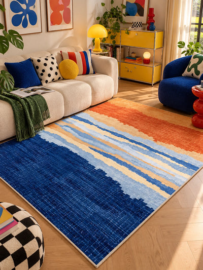 Sunset gradient rug with checkerboard pouf, green throw and yellow shelf unit behind