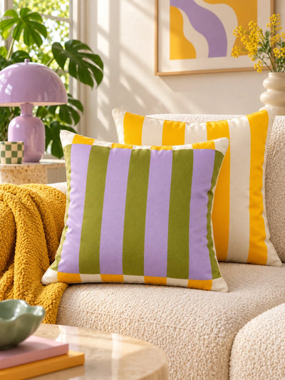 Olive and lilac striped pillow with marigold pillow beside a lilac mushroom lamp