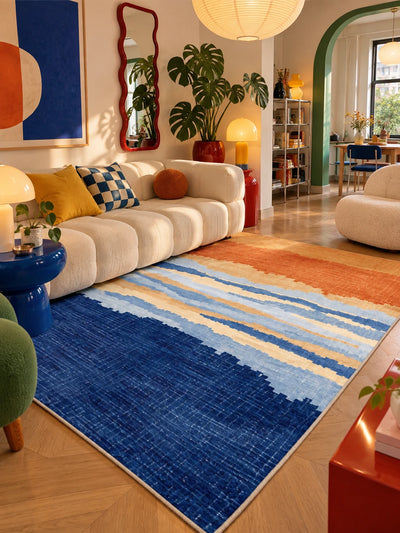 Sunset gradient rug under a paper lantern, red wavy mirror on the wall behind
